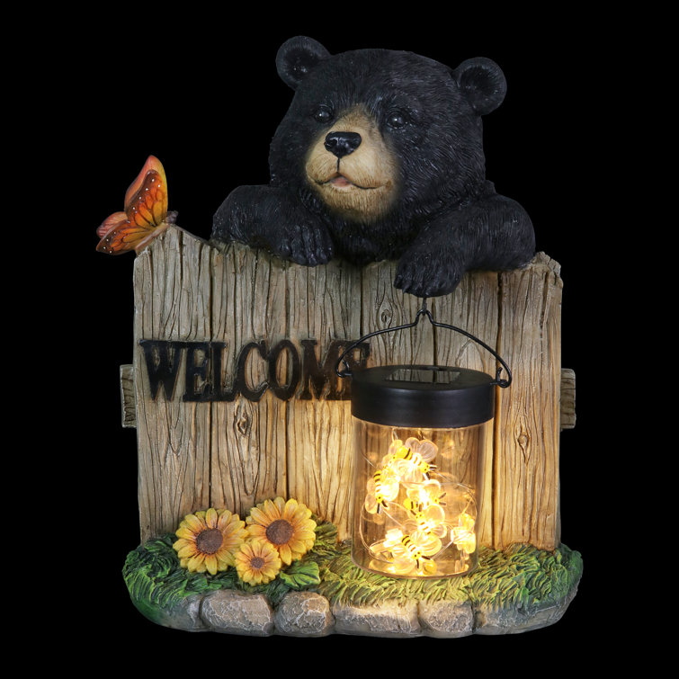 Exhart Solar Hand Painted Bear Garden Statue with a Lantern Jar of LED  Bumblebees by a Welcome Fence